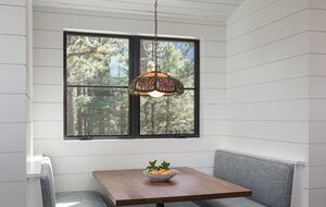 Booth seating with wood table built into shiplap walls