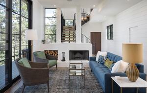 Living room with 10' sliding glass door, fireplace & sofa.