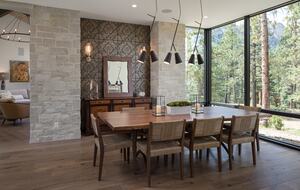 Dining room with table & 8 chairs & floor to ceiling windows