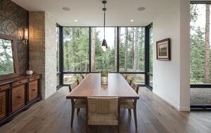 View from the head of the dining room table facing windows