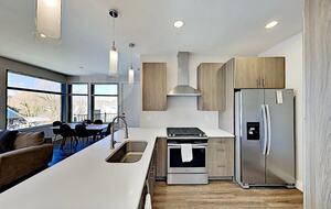 Modern kitchen with island and stainless steel appliances