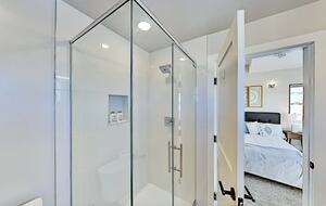 Master bathroom with glass-enclosed walk-in shower