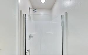 Full bathroom glass-enclosed shower