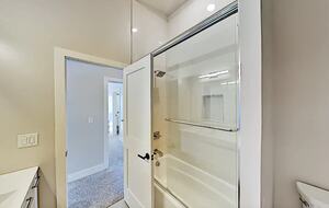 Full bathroom with shower and tub combo