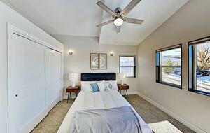 Master bedroom with queen bed and large closet