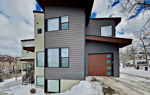 Exterior of ultramodern Steamboat Springs home with garage