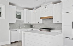 Home exchange in Newport Beach CA, all white kitchen with island
