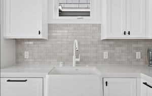 Home exchange in Newport Beach CA, all white kitchen & farmhouse sink
