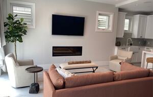 Home exchange in Newport Beach CA, living room with gas fireplace & TV