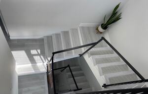 Home exchange in Newport Beach CA, staircase with black railings