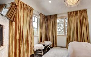 Home exchange in Breckenridge CO, master bedroom with gold curtains