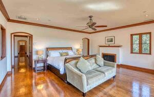 Home exchange in Calistoga CA, master suite with fireplace and sofa