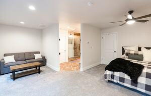 Home exchange in Bass Lake CA, small sofa in master bedroom