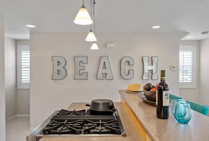 Home exchange in Oxnard CA with galvanized "beach" letter wall decor