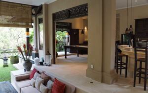 Home exchange in Ubud, Bali, kitchen and dining area open to garden