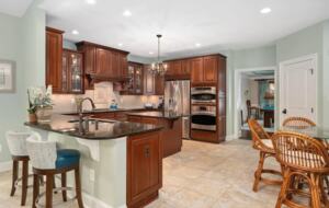 Expansive kitchen with many amenities and eat-in bar