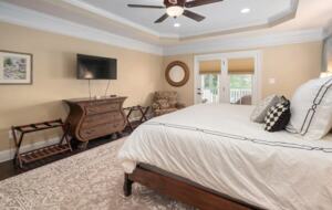 Master suite with French doors and TV
