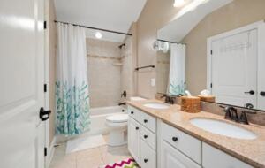 Secondary bathroom with double vanities