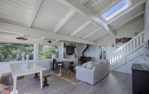 Open cottage living and dining areas