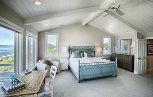 Master bedroom with large patio facing water