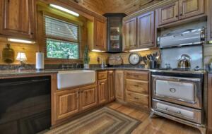Home Exchange in Mineral Bluff, GA, farmhouse sink and charming stove