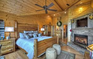 Home Exchange in Mineral Bluff, GA, master bedroom with fireplace