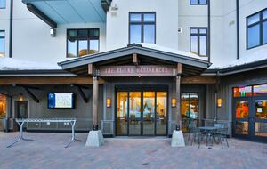 Home Exchange Taos Ski Valley, NM building front with seating