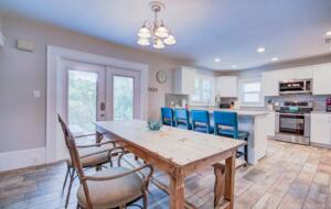 Home Exchange in Clearwater, FL triplex main kitchen with bar seats