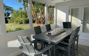 Home Exchange in Naples, FL screened in Lanai dinner table