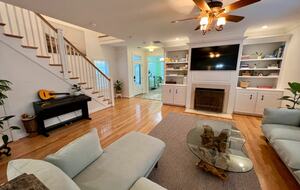 Home Exchange in Virginia Beach, VA family room with fireplace and TV