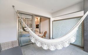 Home exchange in Los Cabos at Garza Blanca Resort, balcony hammock