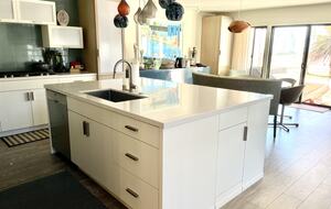 Home Exchange in Oxnard, CA modern kitchen with fun lighting