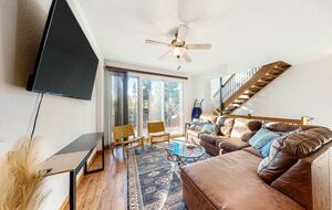 Home Exchange in Fraser, CO family room with cozy seating and large tv