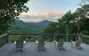 Home exchange in Fairview NC, deck with seating at sunset