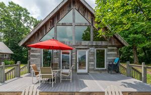 Home exchange in Fairview NC, deck with table, chairs & red umbrella