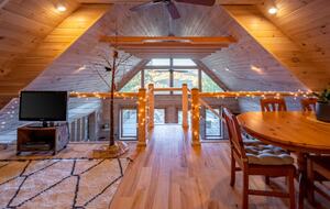 Home exchange in Fairview NC, upper loft with string lights