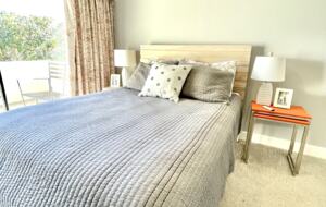 Home Exchange in Oxnard, CA guest bedroom with private patio