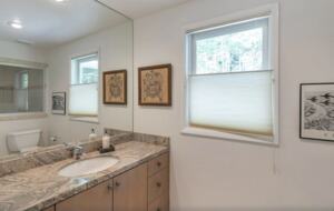 bathroom with steam shower next to office