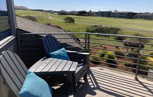 Seating for 2 on primary bedroom balcony.