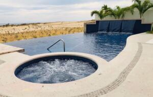 Outdoor pool area and jacuzzi