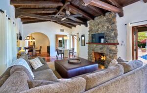 Home Exchange in Palm Springs, CA family room with stone fireplace