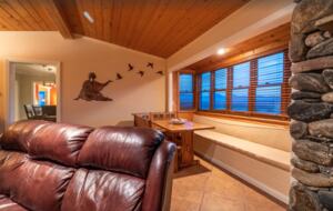 Open living room with fireplace and bench seating