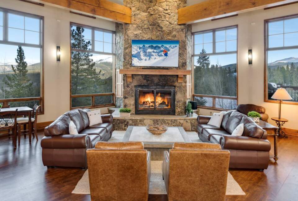 Open living room with fireplace and views