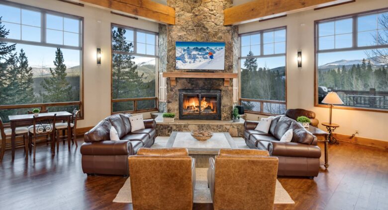 Open living room with fireplace and views