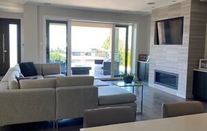 Home Exchange in Vancouver, BC, Canada fireplace with television