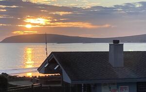 Sunset at Bodega Harbor over HOA Clubhouse.