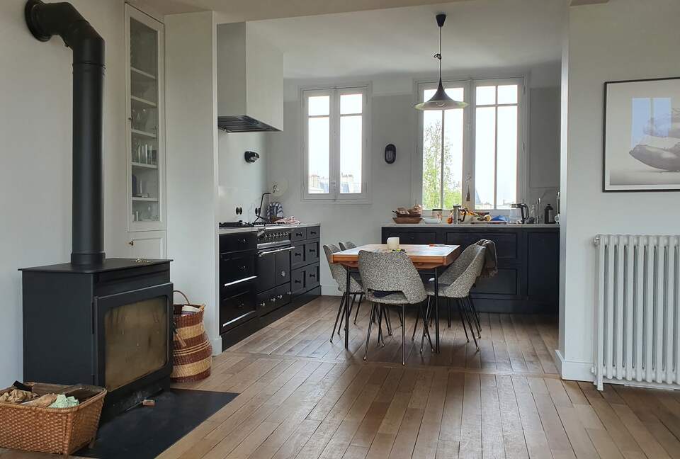 view from the living room into the kitchen, with fire place