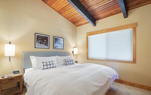 Upstairs Primary Bedroom (King) with ensuite bathroom.