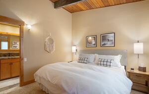 Upstairs Primary Bedroom (King) with ensuite bathroom.