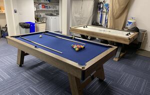 Garage has a game area for guest use.